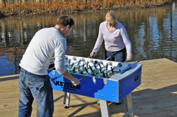 A game of outdoor foosball on the Kettler outdoor foosball table