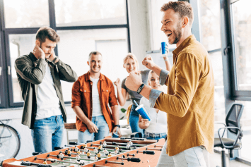 A winner and loser after an office foosball match